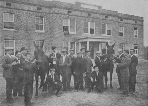 A stock-judging team 1911 with mules. Marvin Williams is at far right. Hainan Holtzclaw kneels at right. The building is Jackson Hall. photo