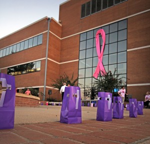 Luminaries line the sidewalk in front of the SAU Business building during the 2013 "Light for the Fight" event.