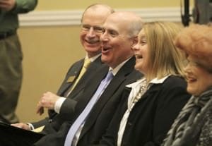 Dr. David Rankin, left, laughs with Dr. Trey Berry and his wife, Dr. Katherine Berry, during Friday's press conference.
