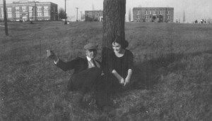 A couple on a date at the foot of the Lone Pine Tree in 1925