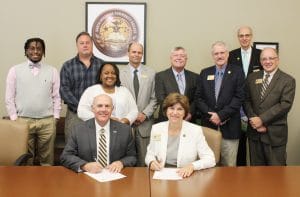 SouthArk and SAU sign transfer agreements
